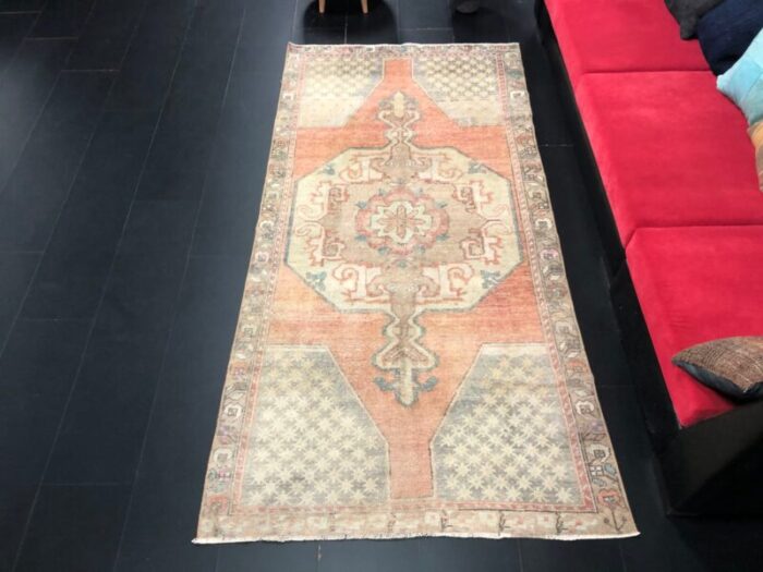 antique faded orange runner rug 1