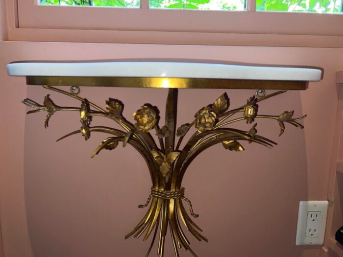 gold and metal marble top wall shelf 1894