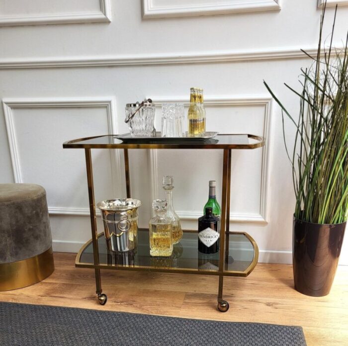 italian two tier brass and glass bar cart with dark glass top by milo baughman 1960s 2