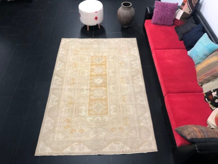 large vintage anatolian faded peach rug 2