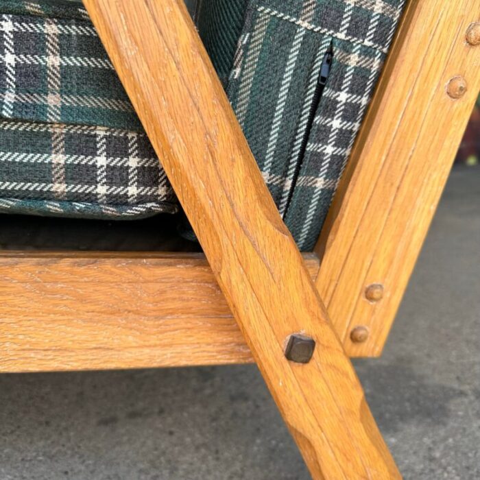 pair of ranch oak lounge chairs reupholstered in plaid from pindler 1151