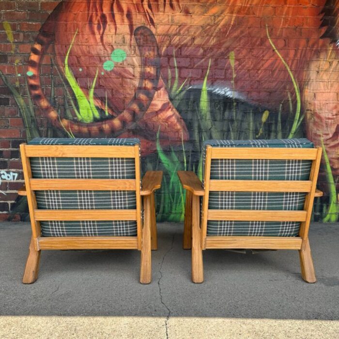 pair of ranch oak lounge chairs reupholstered in plaid from pindler 3113