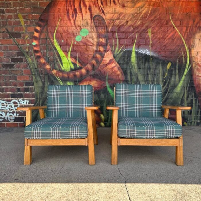 pair of ranch oak lounge chairs reupholstered in plaid from pindler 3889