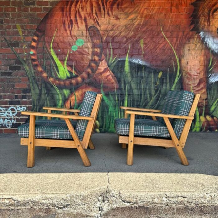 pair of ranch oak lounge chairs reupholstered in plaid from pindler 4569