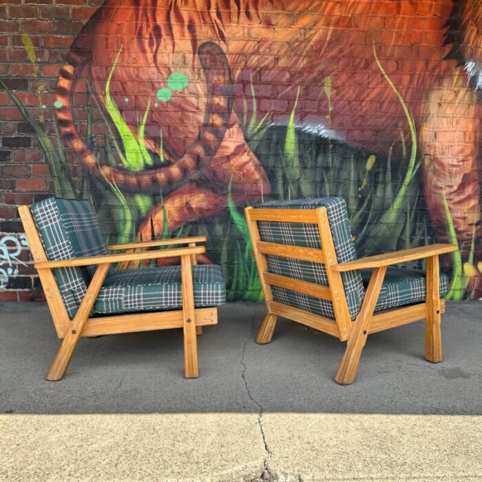 pair of ranch oak lounge chairs reupholstered in plaid from pindler 9542