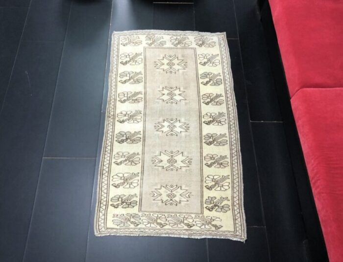 small antique wool tan color pastel rug 1