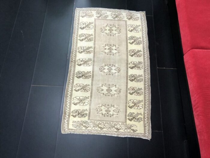 small antique wool tan color pastel rug 2