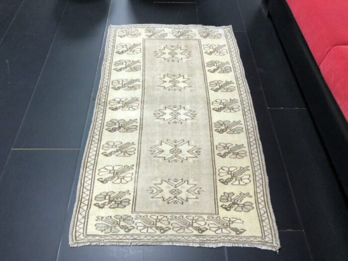 small antique wool tan color pastel rug 3