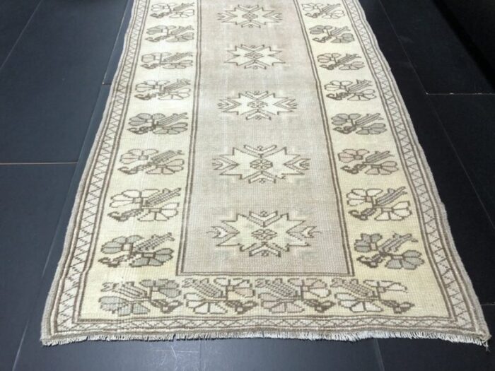 small antique wool tan color pastel rug 9