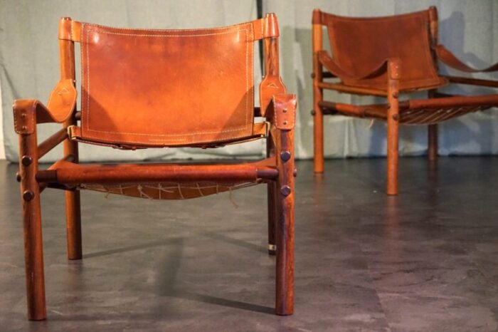 vintage scandinavian sirocco safari teak lounge chairs in cognac leather by arne norell for arne norell ab 1960s set of 2 7032